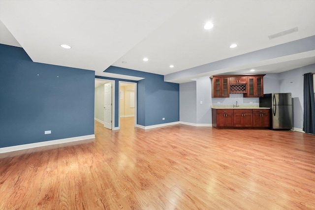 6443 Davane Ct, Downers Grove, IL 60516 - unfurnished living room with wet bar, light wood-type flooring, and recessed lighting