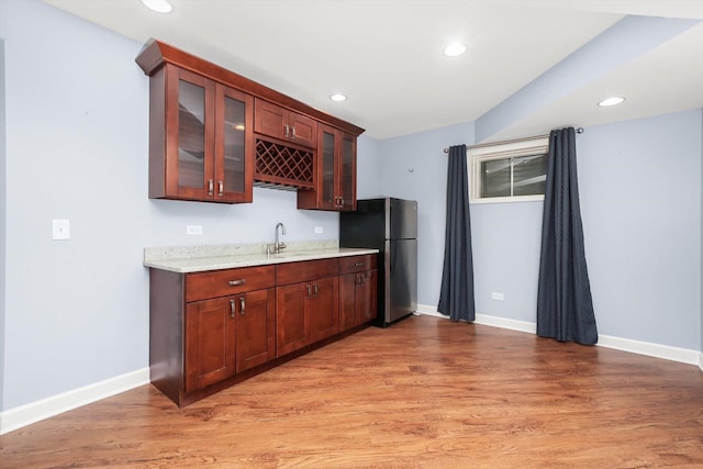 6443 Davane Ct, Downers Grove, IL 60516 - kitchen with freestanding refrigerator, light wood-style floors, recessed lighting, glass insert cabinets, and light stone counters