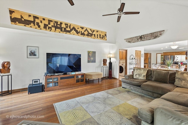 3250 Platte Trl, Olympia Fields, IL 60461 - living room with washer / clothes dryer, wood finished floors, ceiling fan, and a high ceiling