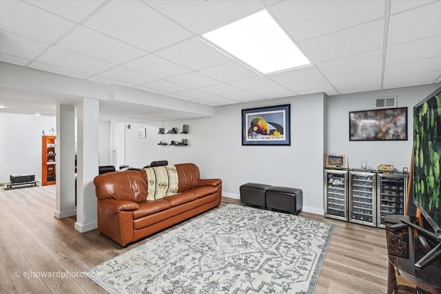 3250 Platte Trl, Olympia Fields, IL 60461 - living room featuring light wood-style flooring, a paneled ceiling, and bar