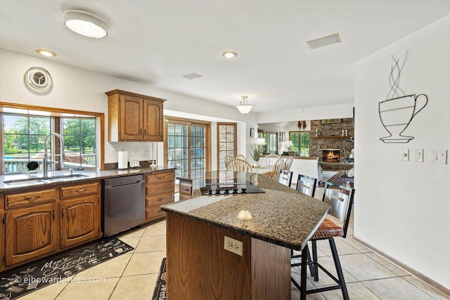 3250 Platte Trl, Olympia Fields, IL 60461 - kitchen with dishwasher, a breakfast bar area, light tile patterned flooring, black electric stovetop, and recessed lighting