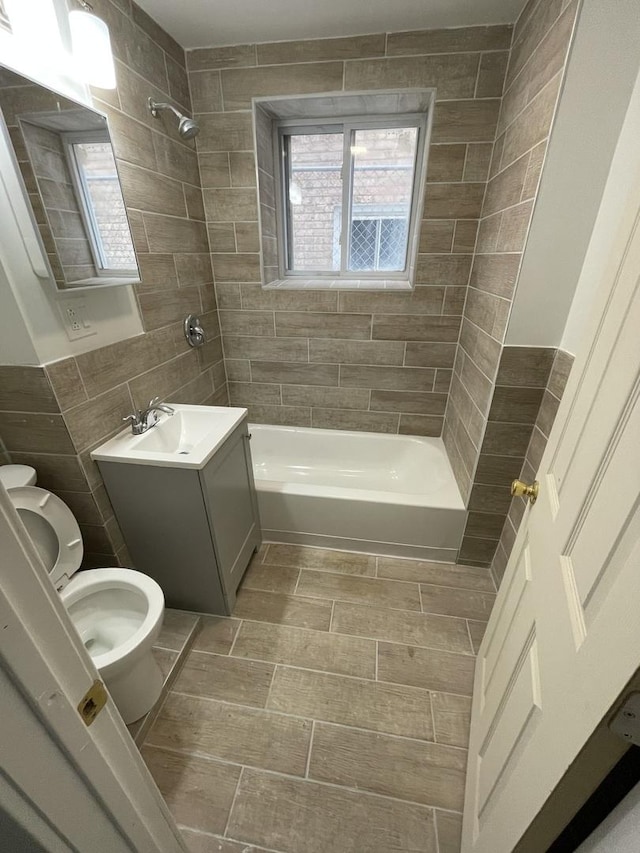 5229 S Campbell Ave, Chicago, IL 60632 - full bathroom featuring shower / bath combination, vanity, and tile walls