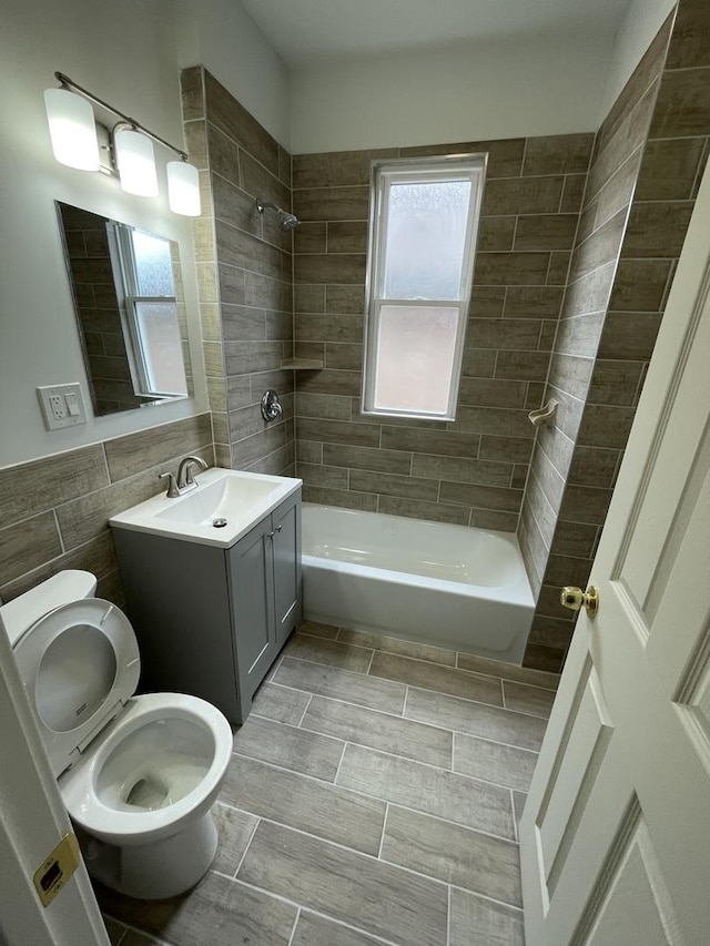 5229 S Campbell Ave, Chicago, IL 60632 - bathroom with bathing tub / shower combination, vanity, and tile walls