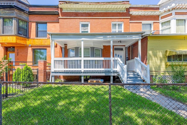 1310 E 72nd St, Chicago, IL 60619 - view of property with brick siding and a porch