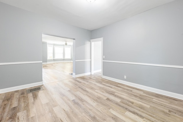 1310 E 72nd St, Chicago, IL 60619 - empty room featuring light wood-style floors and baseboards