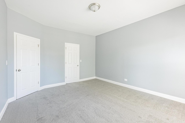 1310 E 72nd St, Chicago, IL 60619 - empty room with carpet flooring