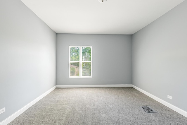 1310 E 72nd St, Chicago, IL 60619 - carpeted spare room featuring baseboards