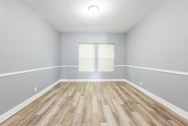 1310 E 72nd St, Chicago, IL 60619 - empty room with wood finished floors and baseboards