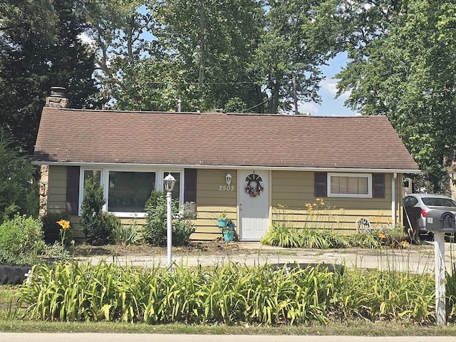 2503 Gaylord Rd, Joliet, IL 60435 - view of front of home featuring a chimney and a shingled roof