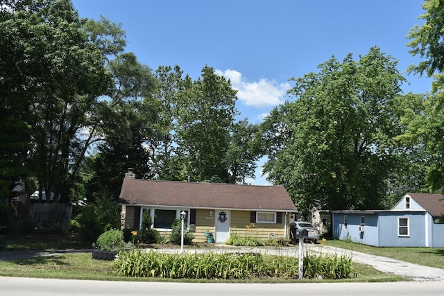 2503 Gaylord Rd, Joliet, IL 60435 - view of front of house with driveway and a chimney
