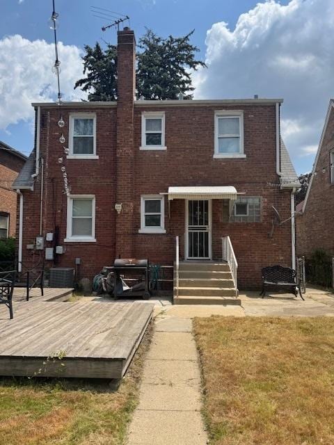 7604 S Campbell Ave, Chicago, IL 60652 - rear view of property featuring a chimney, brick siding, a deck, and a lawn