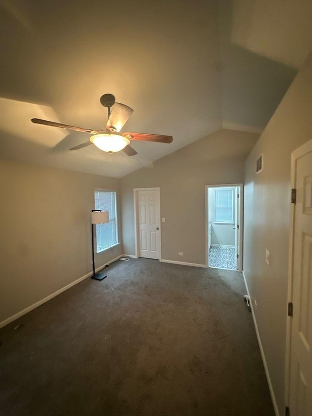 3133 Heritage Blvd, Matteson, IL 60443 - unfurnished bedroom featuring dark colored carpet, lofted ceiling, and a ceiling fan