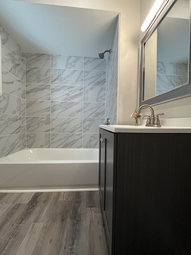 205 N Chicago St, Magnolia, IL 61336 - bathroom with vanity, bathing tub / shower combination, and wood finished floors