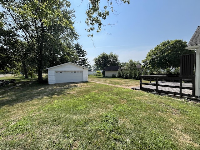 205 N Chicago St, Magnolia, IL 61336 - view of green lawn featuring a garage, an outbuilding, and a deck