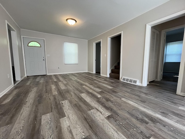 205 N Chicago St, Magnolia, IL 61336 - unfurnished living room featuring dark wood-style flooring, stairway, and healthy amount of natural light