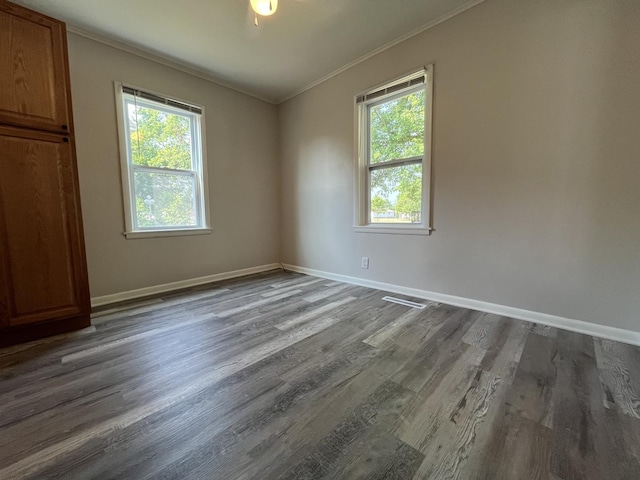 205 N Chicago St, Magnolia, IL 61336 - empty room featuring ornamental molding and dark wood-style flooring
