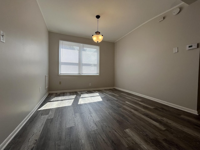 205 N Chicago St, Magnolia, IL 61336 - spare room with dark wood-style flooring, crown molding, and a smoke detector