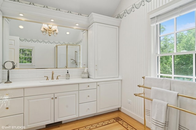 500 E Mayfair Rd, Arlington Heights, IL 60005 - full bath with vanity, a chandelier, wood finished floors, wallpapered walls, and an enclosed shower