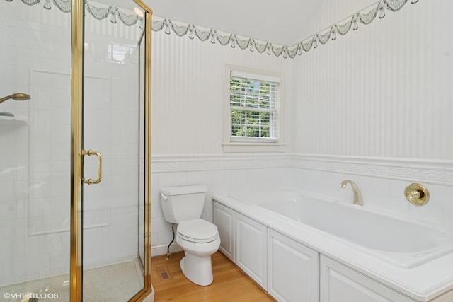 500 E Mayfair Rd, Arlington Heights, IL 60005 - bathroom with a shower stall, a garden tub, wainscoting, and wood finished floors