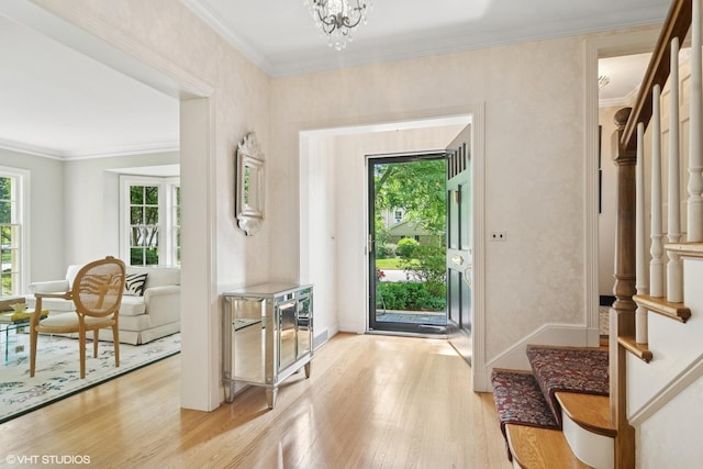 500 E Mayfair Rd, Arlington Heights, IL 60005 - foyer featuring plenty of natural light, stairs, light wood finished floors, ornamental molding, and a chandelier