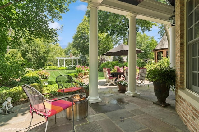 500 E Mayfair Rd, Arlington Heights, IL 60005 - view of patio / terrace with an outdoor fire pit, view of scattered trees, and a pergola