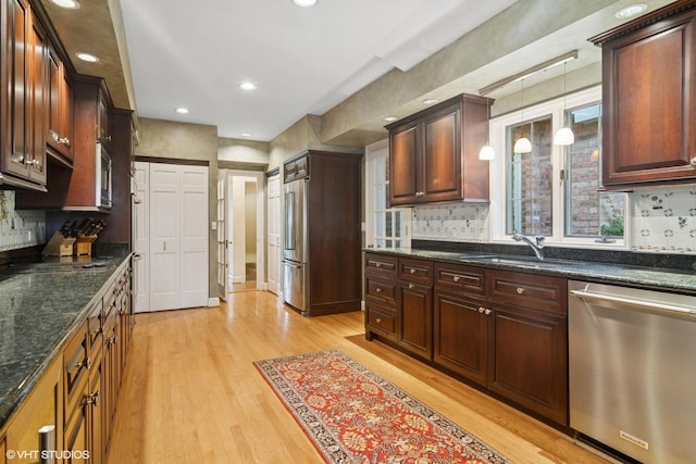 500 E Mayfair Rd, Arlington Heights, IL 60005 - kitchen with stainless steel appliances, light wood finished floors, backsplash, decorative light fixtures, and recessed lighting