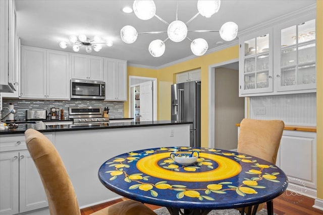 1519 Wedgefield Cir, Naperville, IL 60563 - kitchen with stainless steel appliances, tasteful backsplash, glass insert cabinets, white cabinets, and dark countertops