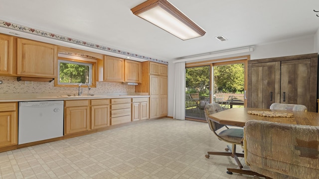 8033 S Pine St, Dixon, IL 61021 - kitchen featuring dishwasher, healthy amount of natural light, and light countertops