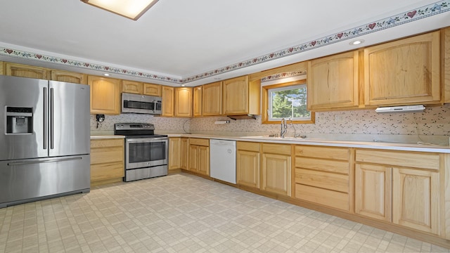 8033 S Pine St, Dixon, IL 61021 - kitchen with stainless steel appliances, light brown cabinets, light countertops, and light floors