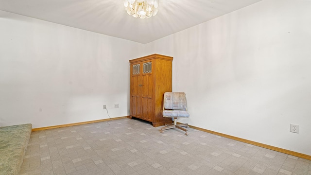 8033 S Pine St, Dixon, IL 61021 - spare room with a chandelier and baseboards