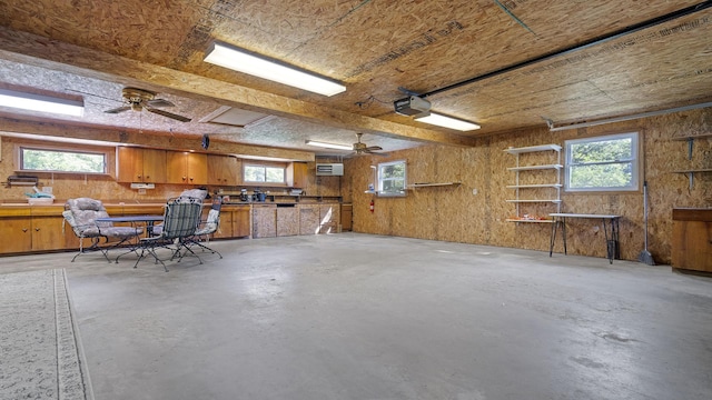 8033 S Pine St, Dixon, IL 61021 - garage featuring ceiling fan and wooden walls