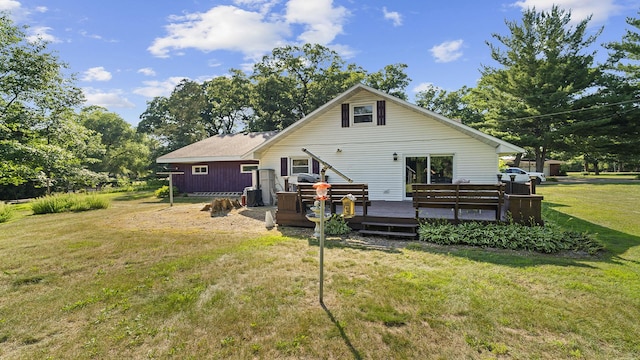 8033 S Pine St, Dixon, IL 61021 - back of property featuring a wooden deck and a lawn