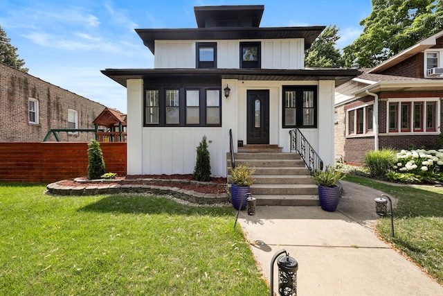 3330 E Ave, Berwyn, IL 60402 - traditional style home with a front yard, board and batten siding, and entry steps