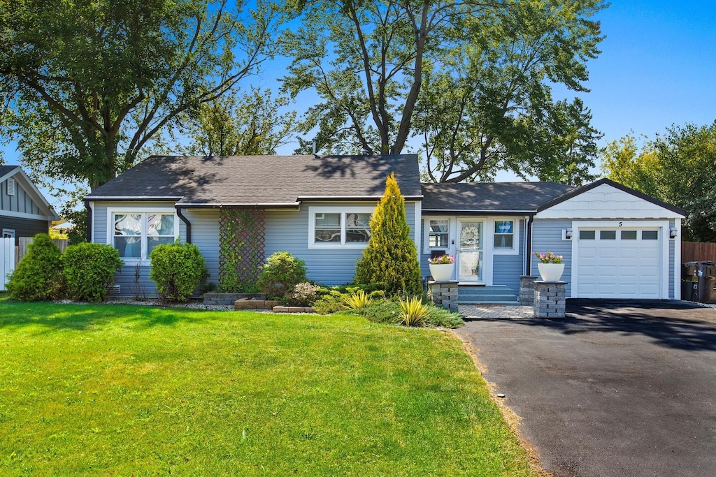 5 Pamela Rd, Lake Zurich, IL 60047 - view of front of property featuring asphalt driveway, a garage, a front yard, and a shingled roof