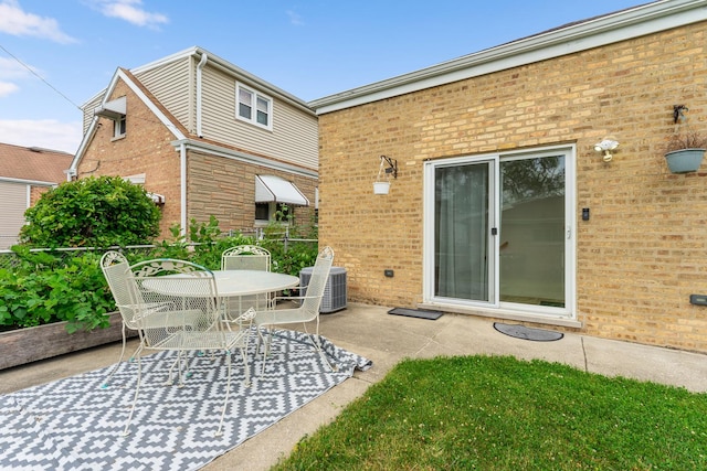 4308 N Ozark Ave, Norridge, IL 60706 - back of house with brick siding, a patio area, and outdoor dining area