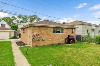 4308 N Ozark Ave, Norridge, IL 60706 - view of side of property featuring a lawn and brick siding
