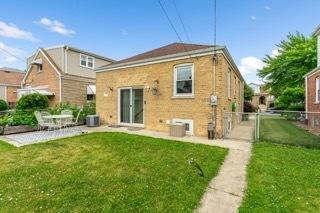 4308 N Ozark Ave, Norridge, IL 60706 - rear view of house with a patio area