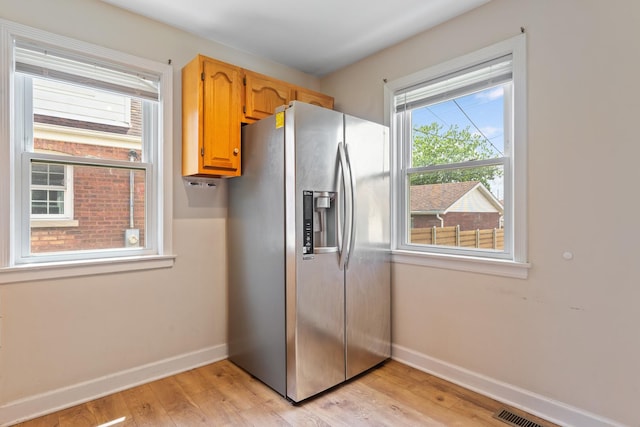 4308 N Ozark Ave, Norridge, IL 60706 - kitchen featuring stainless steel fridge and light wood finished floors