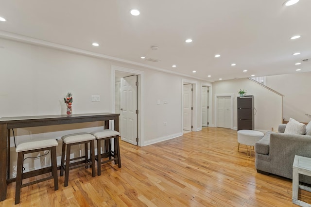 4308 N Ozark Ave, Norridge, IL 60706 - living room with light wood-type flooring, recessed lighting, and stairway