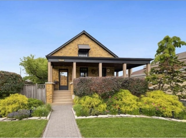 7246 N Oleander Ave, Chicago, IL 60631 - view of front of house with covered porch and a front yard
