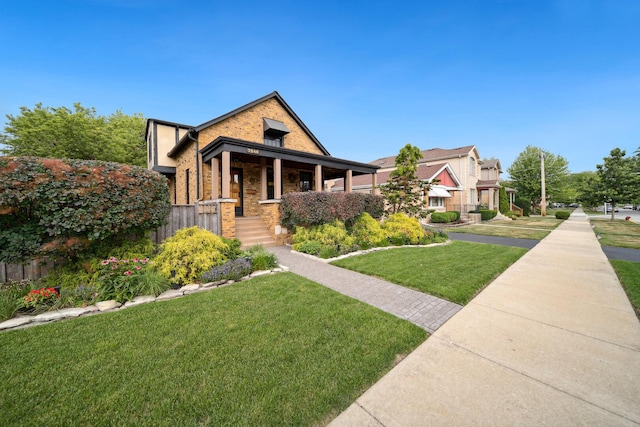 7246 N Oleander Ave, Chicago, IL 60631 - craftsman-style house featuring a front yard, brick siding, and a porch