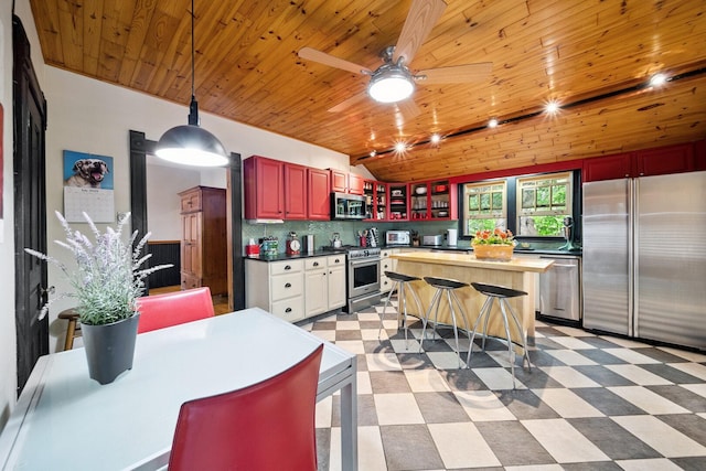 7246 N Oleander Ave, Chicago, IL 60631 - kitchen featuring high quality appliances, light floors, wooden ceiling, vaulted ceiling, and reddish brown cabinets