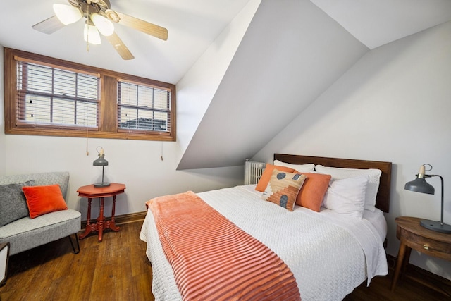 7246 N Oleander Ave, Chicago, IL 60631 - bedroom with wood finished floors, vaulted ceiling, ceiling fan, and radiator heating unit