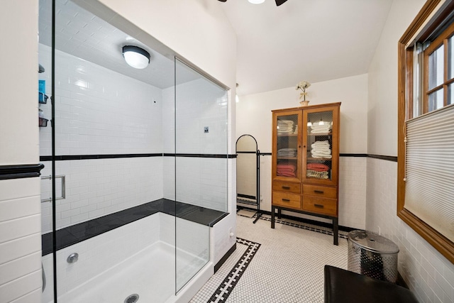 7246 N Oleander Ave, Chicago, IL 60631 - bathroom with a shower stall, tile walls, lofted ceiling, and ceiling fan