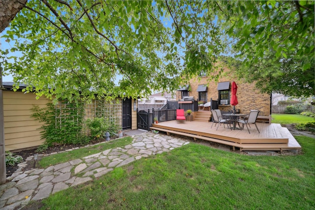 7246 N Oleander Ave, Chicago, IL 60631 - view of yard featuring a deck and a gate