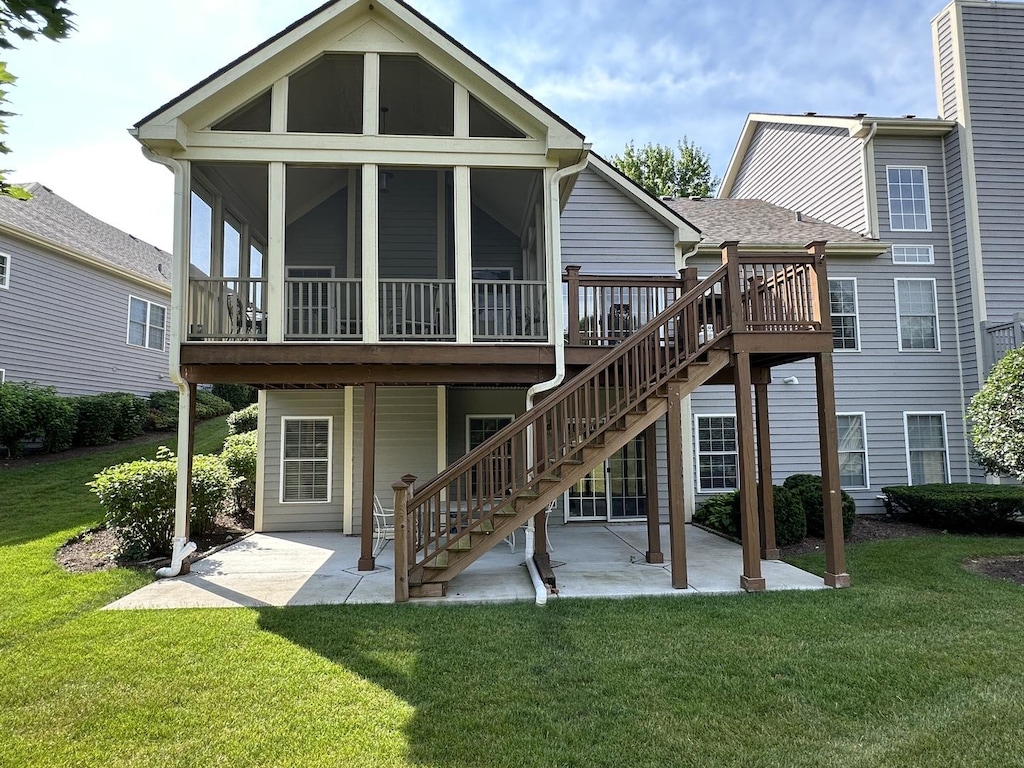2017 Mallard Ln, Woodstock, IL 60098 - rear view of house with a patio, stairs, a wooden deck, and a yard