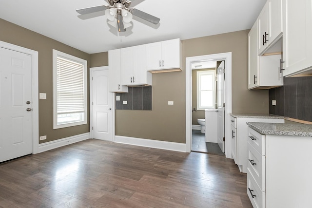 12300 Maple Ave, Blue Island, IL 60406 - kitchen featuring a ceiling fan, plenty of natural light, dark wood finished floors, and white cabinetry
