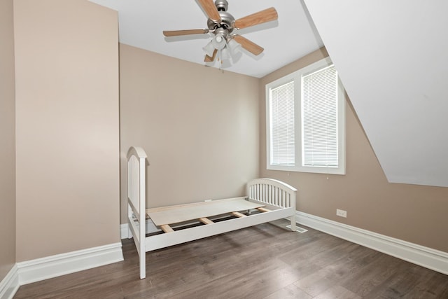 12300 Maple Ave, Blue Island, IL 60406 - unfurnished bedroom with wood finished floors, ceiling fan, and arched walkways