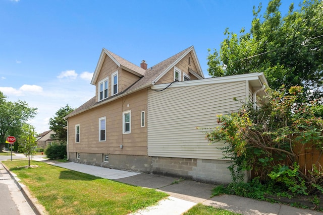 12300 Maple Ave, Blue Island, IL 60406 - view of home's exterior featuring a shingled roof and a yard
