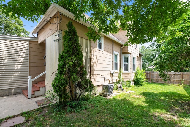 12300 Maple Ave, Blue Island, IL 60406 - view of home's exterior featuring a central AC unit